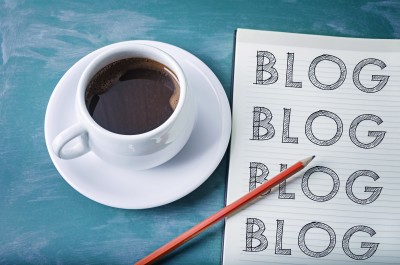 Blog blog blog- blogging concept on a notebook with cup of espresso coffee blog, management, let us make your life easy